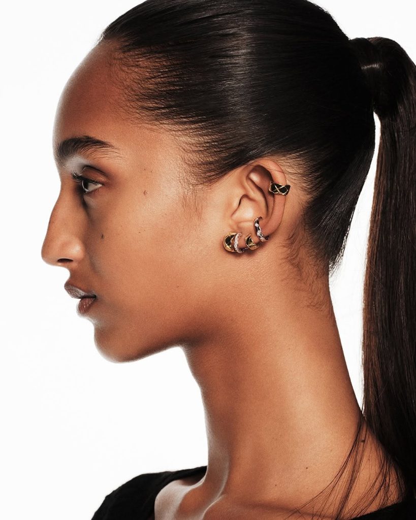 woman wearing chanel coco crush earrings a jewelry trend for 2025