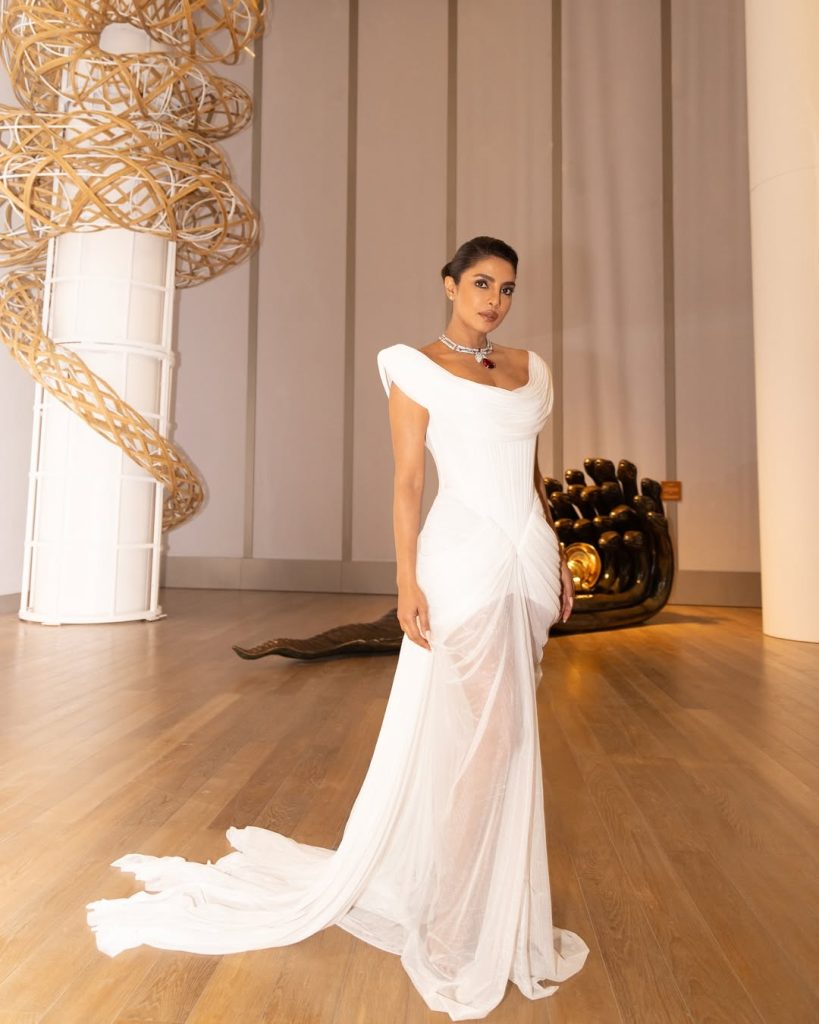 priyanka wearing a white dress at bvlgari serpenti infinito exhibition mumbai 