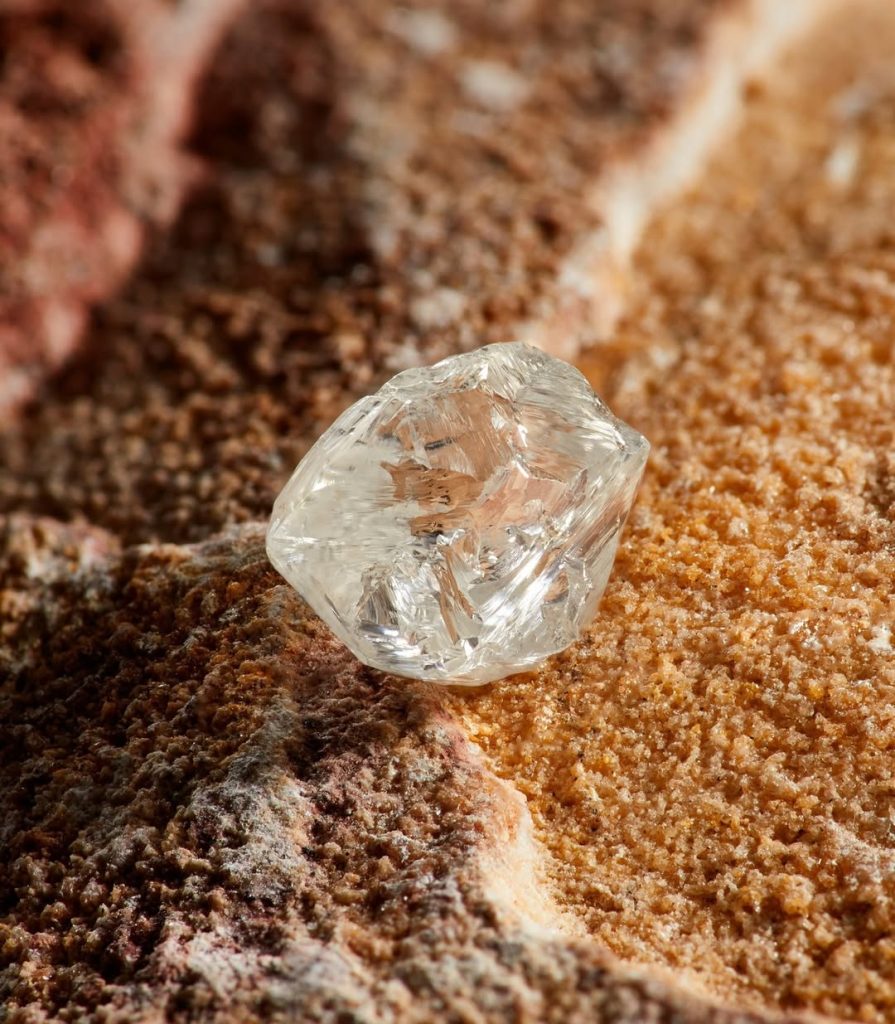 rough diamond on sand