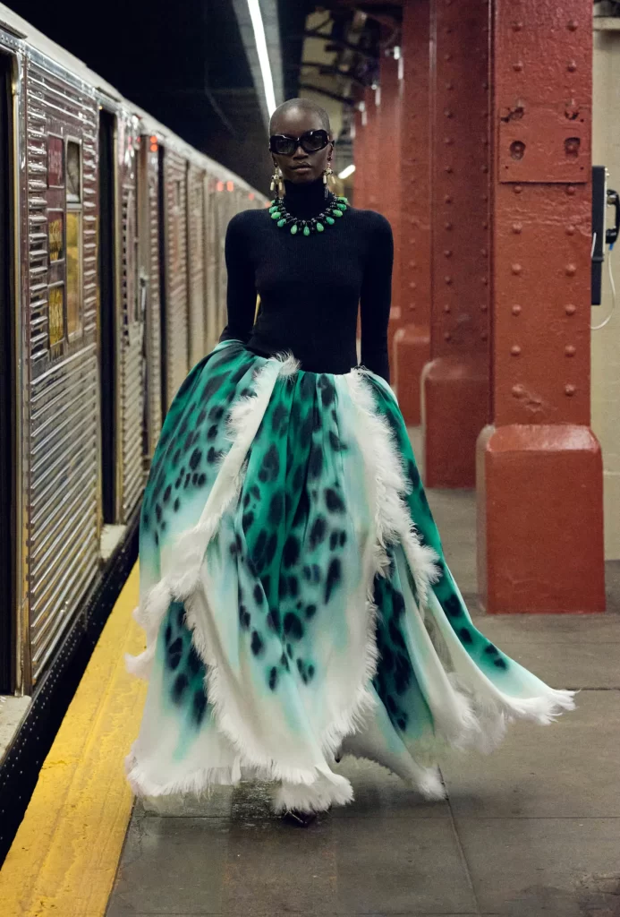 woman wearing chanel green and black bib necklace