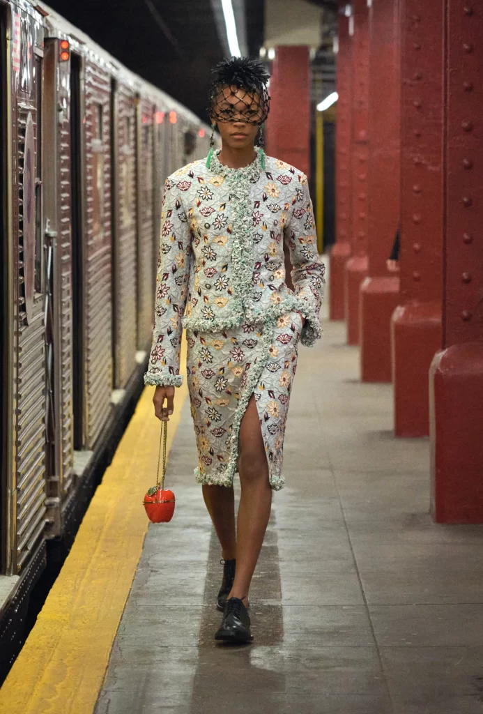 model wearing chanel métiers d'art 2026 red apple bags