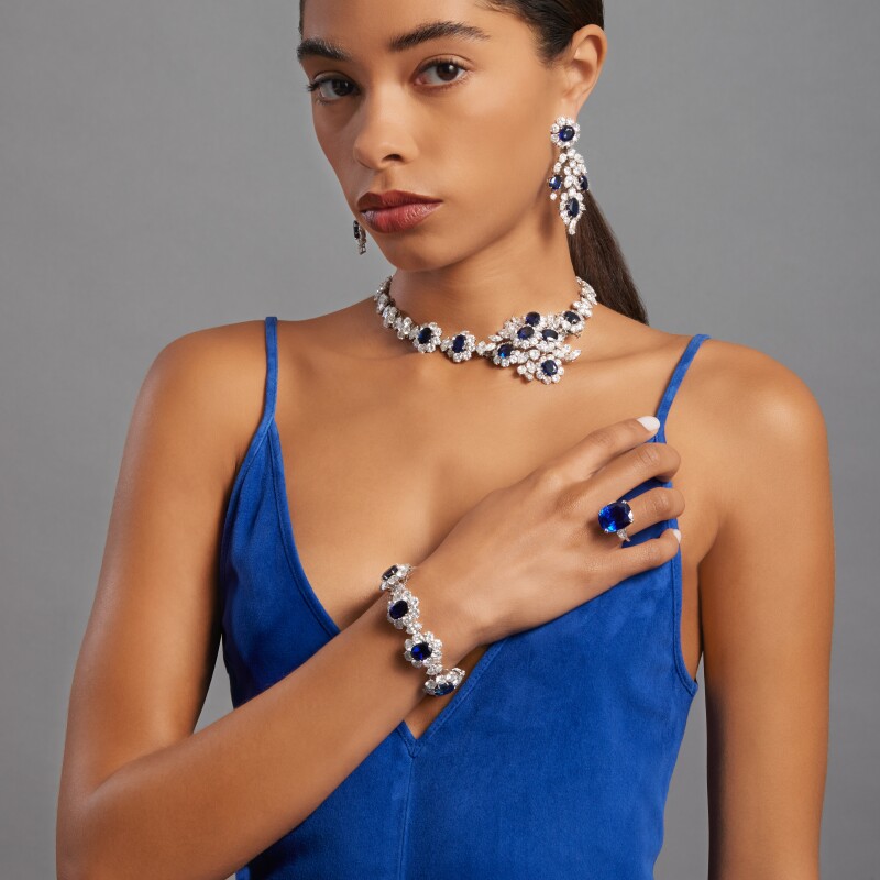 woman wearing van cleef sapphire and diamond suite sotheby's
