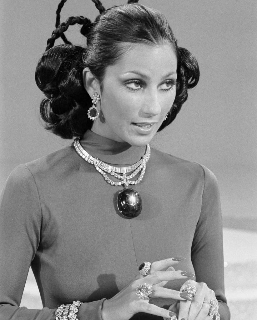 cher wearing the black star of queensland