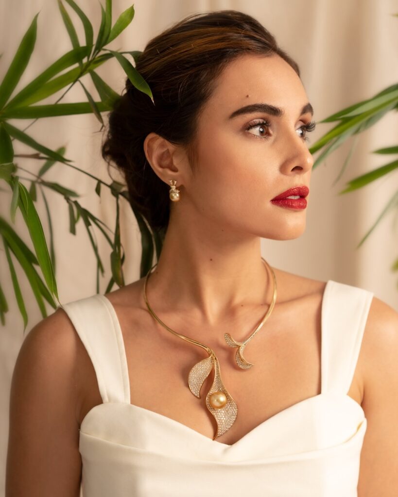 woman wearing floral pearl jewelry necklace