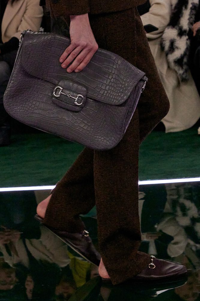 man carrying maxi bag