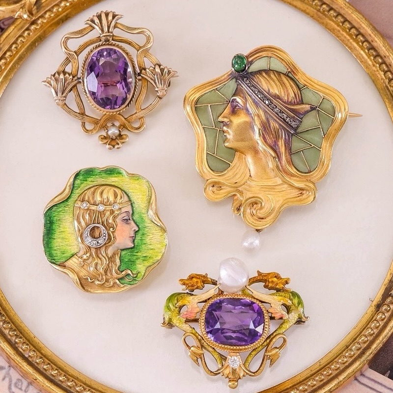 a group of four art noveau brooches