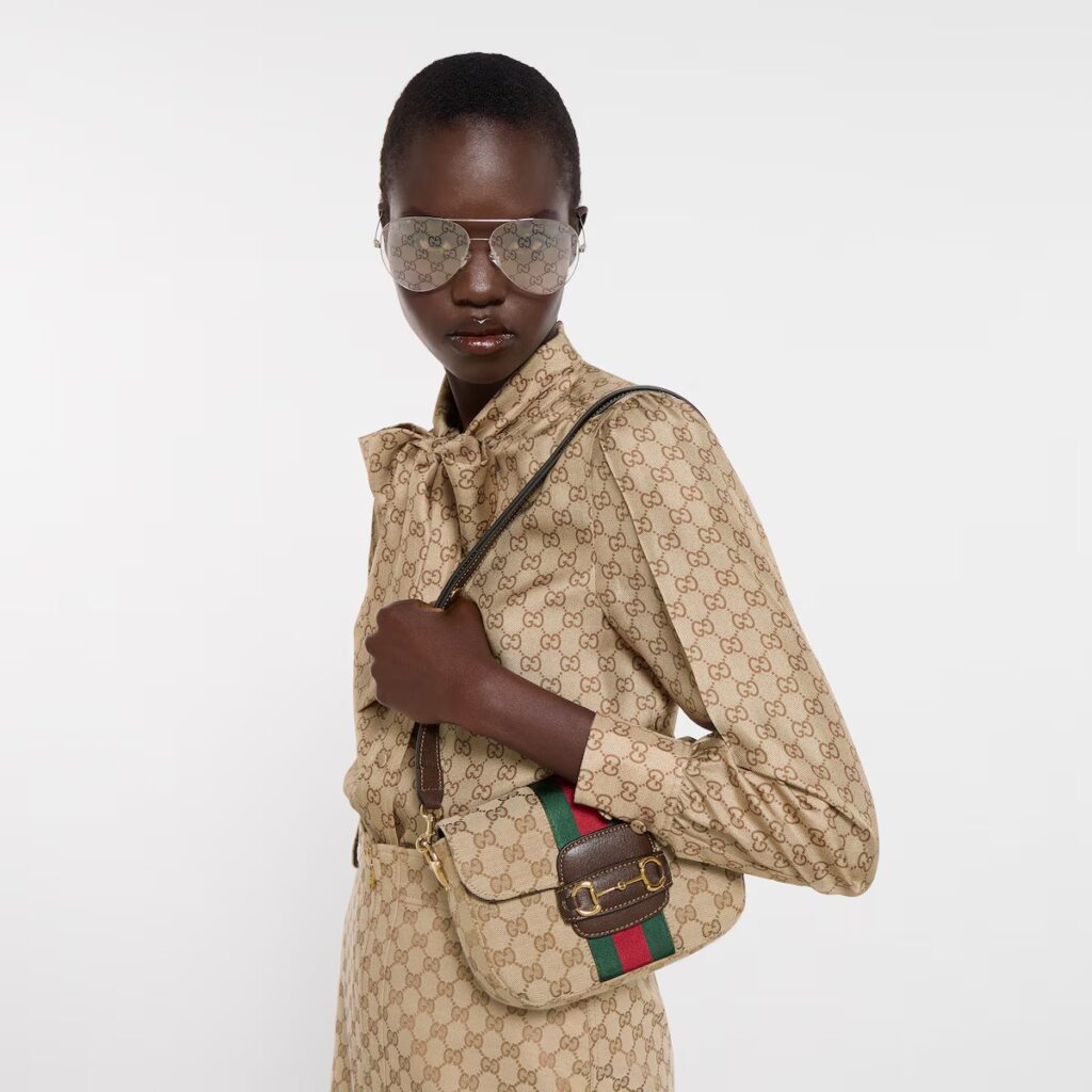model wearing gucci horsebit bag 1955