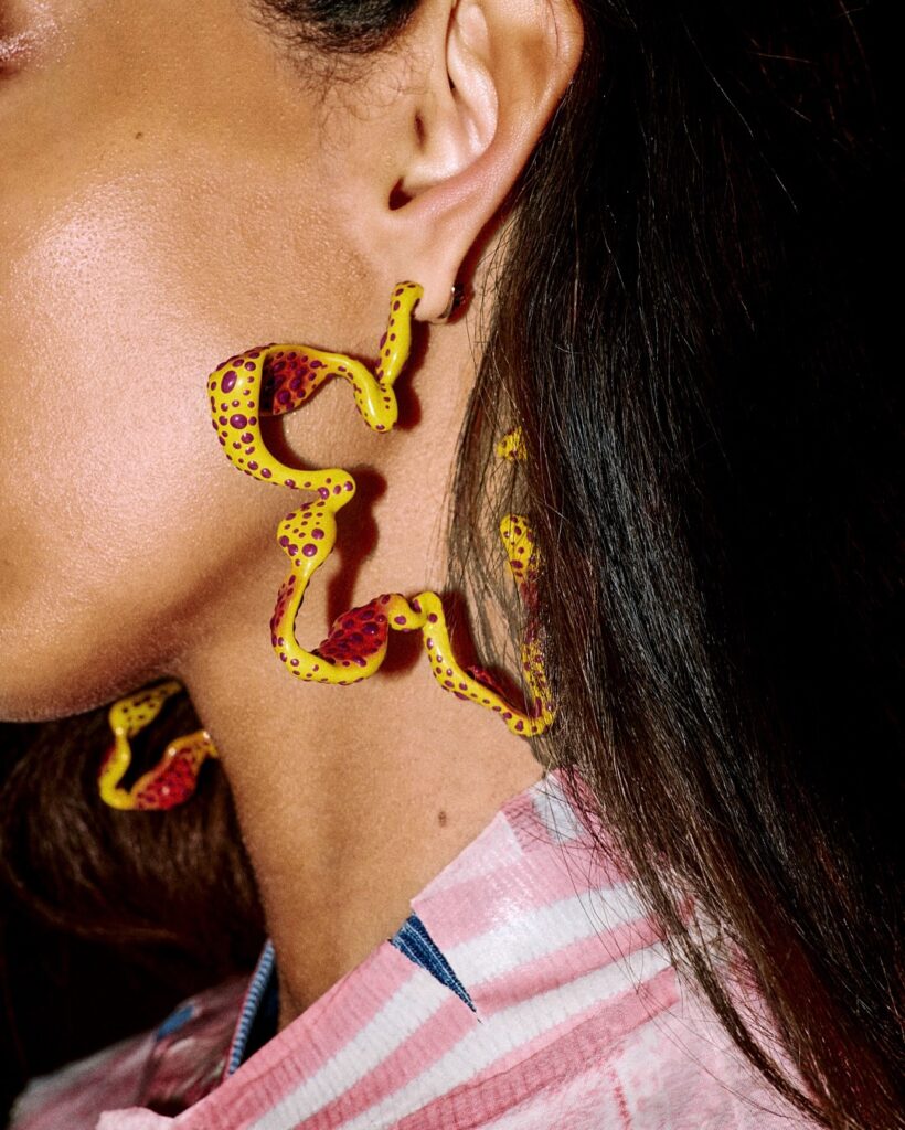 model wearing diesel colorful earrings