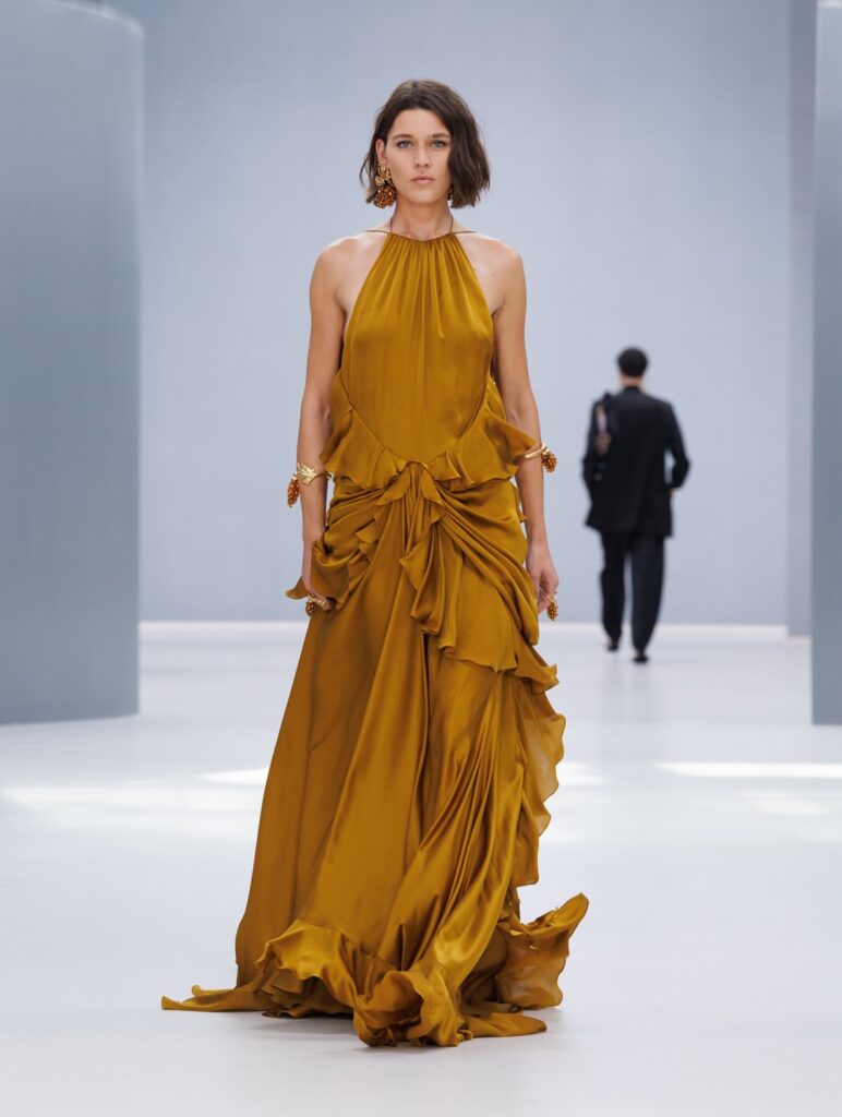 model wearing gold dress and gold cuff jewelry paris fashion week zimmerman spring 2027